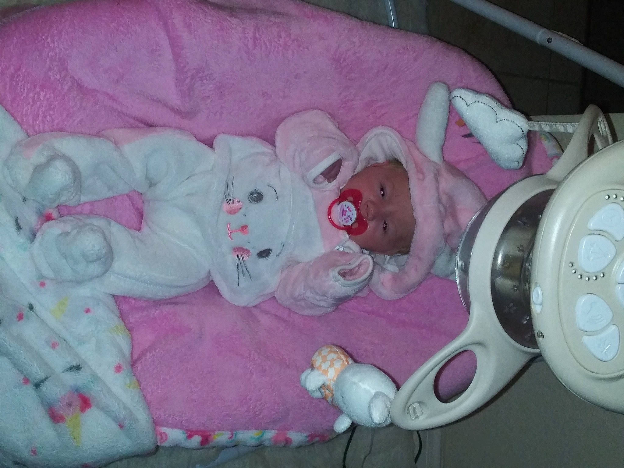 Milena is registered to the contest to win money with this photo: audio_equipment, baby, baby_products, baby_sleeping, baby_toddler_clothing, baby_toys, child, clock, comfort, headwear, home_appliance, infant_bed, linens, magenta, person, pink, product, stuffed_toy, textile, toddler