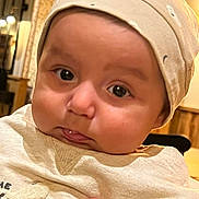 Alex participe au concours pour gagner de l'argent avec cette photo : baby, infant, face, hat, clothing, hand, indoor, portrait, cute, expression, skin, cheeks, eyes, person, child, human, apparel, headwear, closeup, young