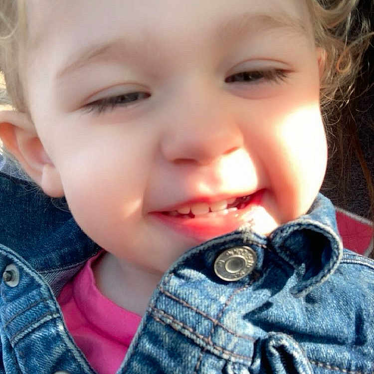 Leotie joined the competition — help win amazing prizes! baby, button, casual_wear, child, closeup, clothing, curly_hair, cute, denim_jacket, expression, face, happy, outdoor, person, portrait, skin, smiling, sunlight, toddler, young_child