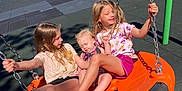 Leotie is registered to the contest to win money with this photo: baby, barefoot, casual_clothing, child, children, daytime, family, friends, fun, girl, happy, outdoor, park, play, playground, recreation, smiling, summer, sunlight, swing