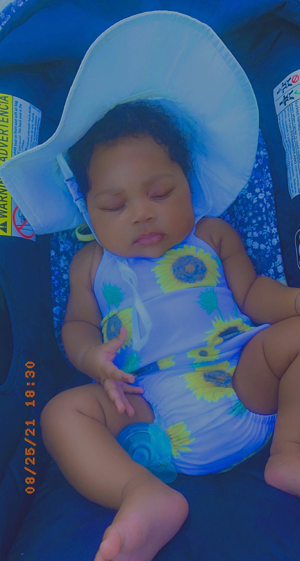 Khalessi is registered to the contest to win money with this photo: azure, baby, baby_toddler_clothing, blue, cap, cheek, facial_expression, fun, headgear, human_body, iris, lip, mouth, person, pink, purple, skin, sun_hat, thigh, toddler