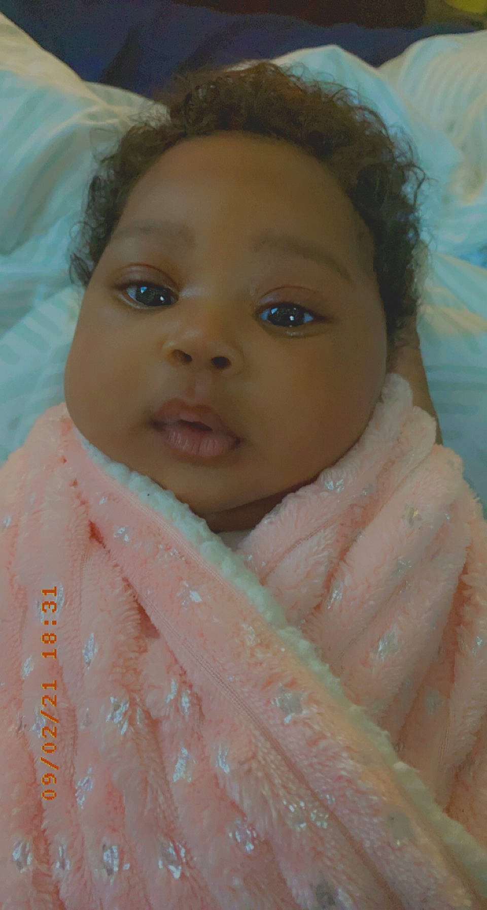 Khalessi is registered to the contest to win money with this photo: baby, cheek, child, chin, eye, eyebrow, eyelash, facial_expression, forehead, happy, human_body, iris, lip, mouth, neck, nose, organ, person, skin, sleeve