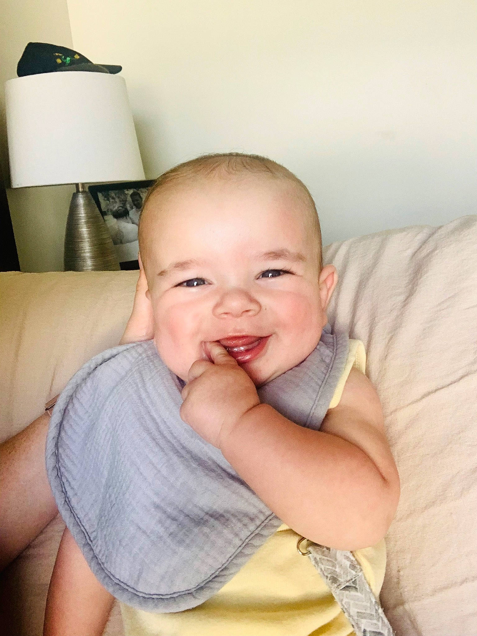 Cooper is registered to the contest to win money with this photo: arm, baby, baby_toddler_clothing, cheek, chest, child, comfort, elbow, eyelash, finger, gesture, hand, happy, joy, lamp, nose, person, skin, sleeve, smile