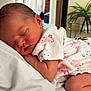 Aoife is registered to the contest to win money with this photo: newborn, baby, sleeping, onesie, infant, cute, peaceful, skin, face, arm, head, home, indoor, soft_light, person, child, clothing, rest, closeup, tender