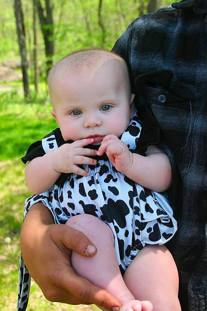 Remingtyn is registered to the contest to win money with this photo: baby, baby_toddler_clothing, child, dress, eye, face, finger, flash_photography, grass, happy, iris, pattern, people_in_nature, person, plant, sitting, skin, sleeve, tie, toddler
