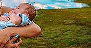 Zaiel joined the competition — help win amazing prizes! baby, infant, child, portrait, being_held, adult, arms, lake, mountains, water, landscape, outdoors, nature, grass, trees, reflection, blue_sky, family, caring, peaceful
