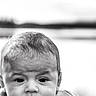 Zaiel is registered to the contest to win money with this photo: baby, infant, child, portrait, black_and_white, close_up, face, eyes, hair, hand, arm, clothing, sitting, looking_at_camera, serious_expression, soft_lighting, indoor, photography, monochrome, adorable