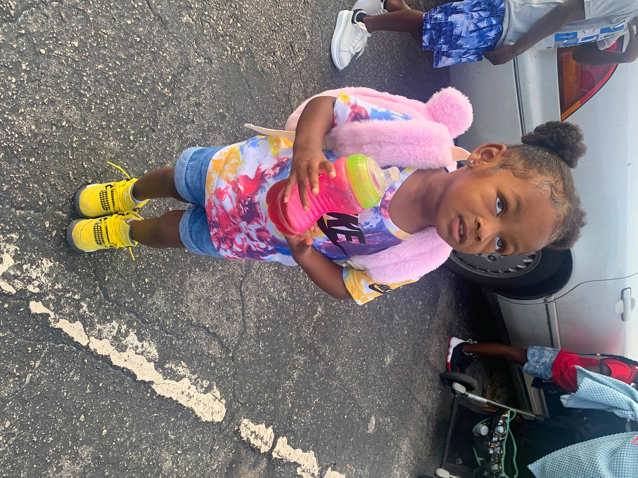 Teyana is registered to the contest to win money with this photo: asphalt, baby, child, city, concrete, fun, happy, leisure, pedestrian, person, play, recreation, road, road_surface, shoe, sidewalk, sneakers, street, tar, toddler