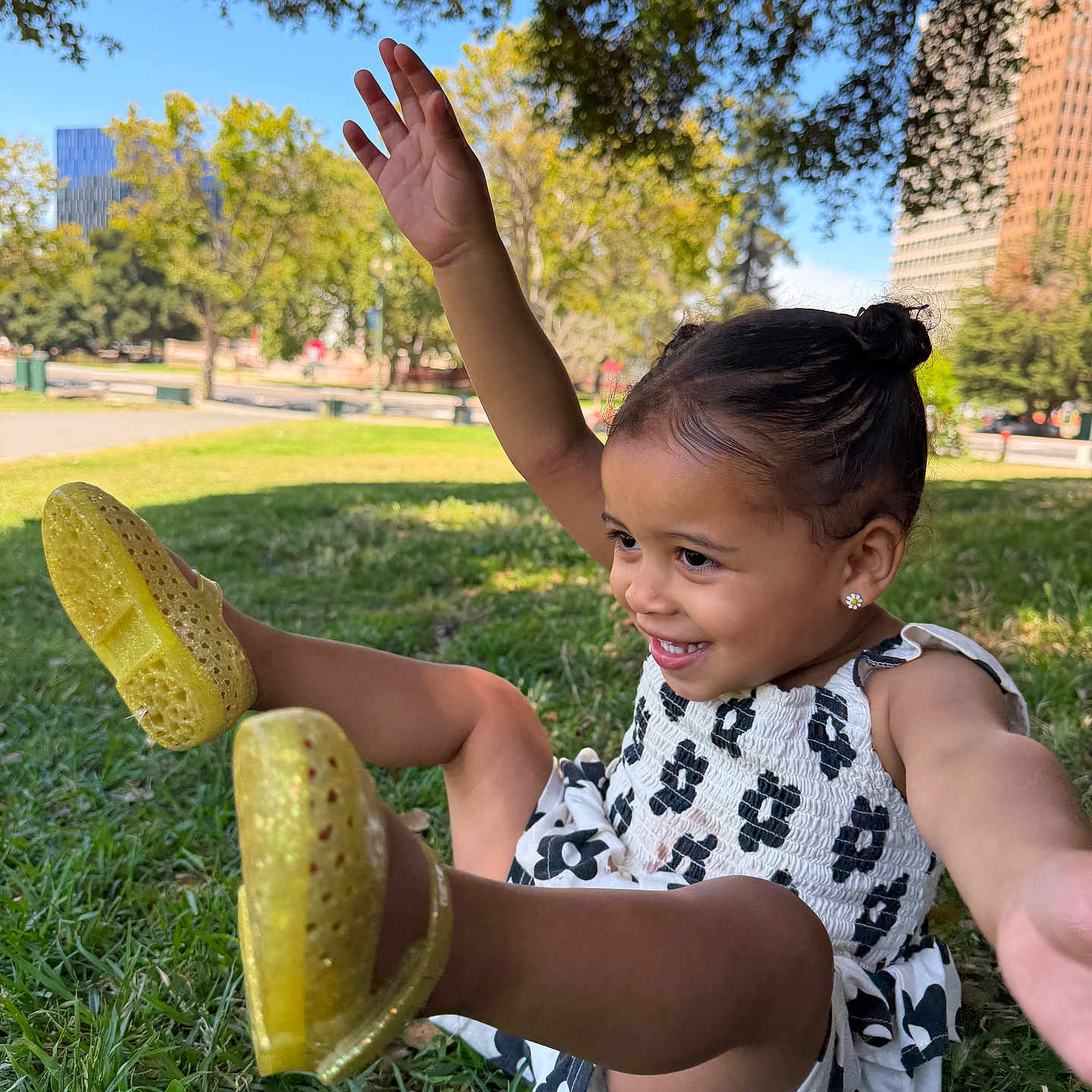 Lola Valentine joined the competition — help win amazing prizes! child, girl, smile, grass, park, trees, sunlight, dress, yellow_shoes, earrings, outdoor, happy, playful, building, nature, greenery, daytime, person, cute, fun