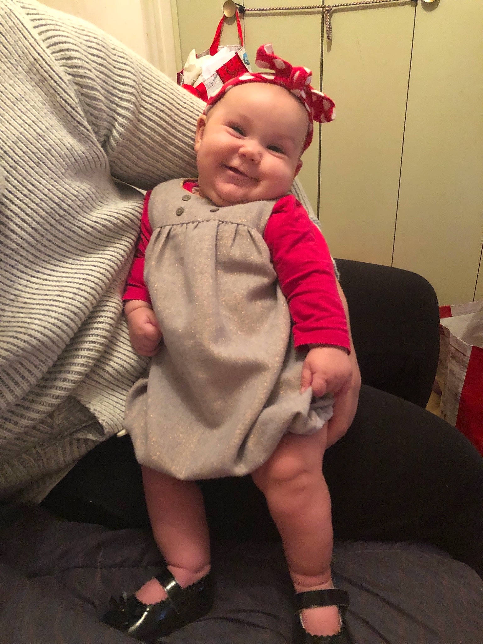 Ayana participe au concours pour gagner de l'argent avec cette photo : arm, baby_products, child, day, ear, girl, headgear, infant, leg, organ, outerwear, person, pink, product, red, sitting, skin, smile, standing, textile