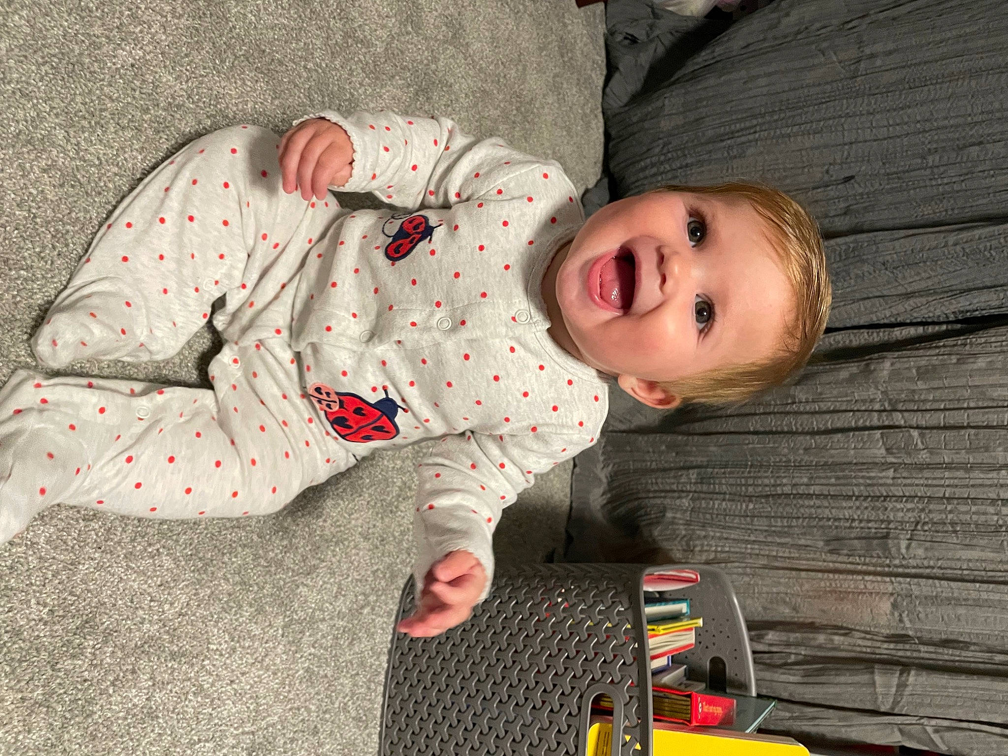 Melanie joined the competition — help win amazing prizes! baby, baby_toddler_clothing, carmine, child, comfort, flooring, fun, grass, happy, linens, mammal, nightwear, pattern, person, portrait_photography, sitting, sleeve, smile, toddler, under_exposed