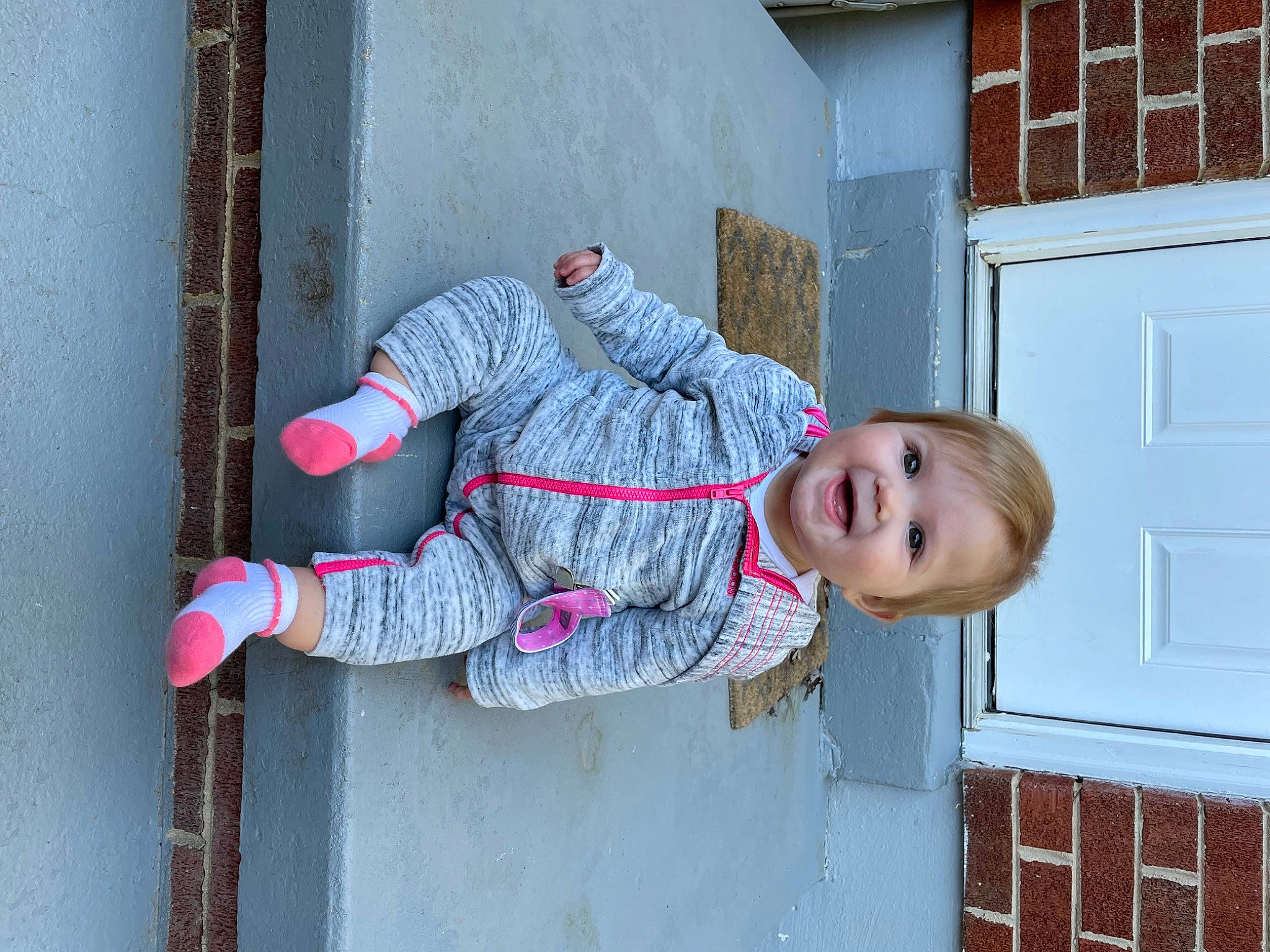Melanie joined the competition — help win amazing prizes! blue, carmine, child, concrete, door, electric_blue, fun, happy, hat, human_leg, joy, leg, pattern, person, pink, sleeve, smile, street_fashion, textile, toddler