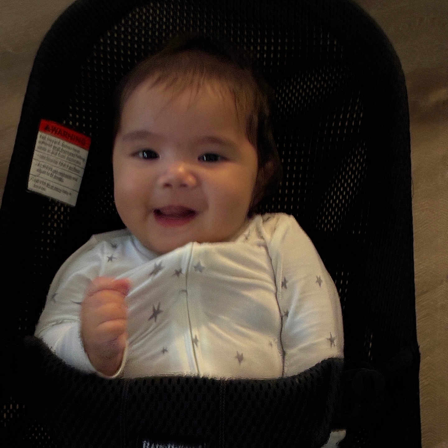 Riley joined the competition — help win amazing prizes! baby, baby_seat, babybjorn, black, child, clothing, comfort, cute, fabric, face, happy, indoor, infant, onesie, pattern, person, seat, smiling, white, young_child