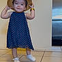 Lady is registered to the contest to win money with this photo: toddler, child, indoor, floor, tiles, dress, blue_dress, polka_dot, shoes, white_shoes, hat, straw_hat, smile, standing, bracelet, cute, baby, person, happy, portrait