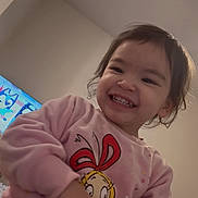 Lady joined the competition — help win amazing prizes! child, toddler, smiling, indoor, sweater, cartoon, television, happy, portrait, person, clothing, face, young_child, cute, playful, fun, home, casual, cheerful, expression
