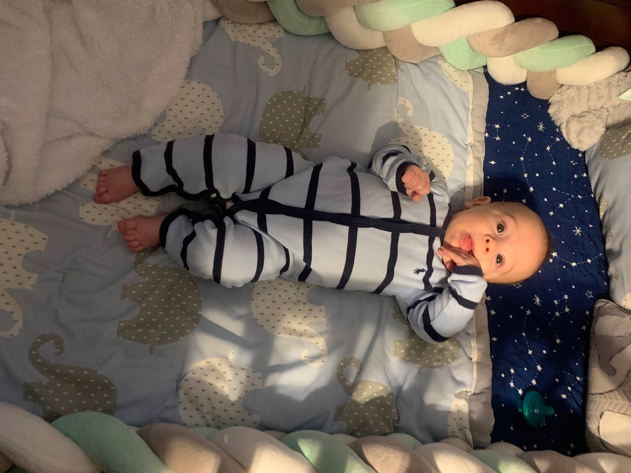 Vinny is registered to the contest to win money with this photo: baby, baby_products, baby_toddler_clothing, child, comfort, foot, human_body, human_leg, knee, leg, light, linens, nail, pattern, person, product, room, sitting, thigh, toddler