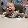 Malachi joined the competition — help win amazing prizes! baby, high_chair, laughing, happy, child, infant, polka_dot, curtain, indoor, seat, clothing, strap, mouth_open, joyful, face, person, room, wall, furniture, smile