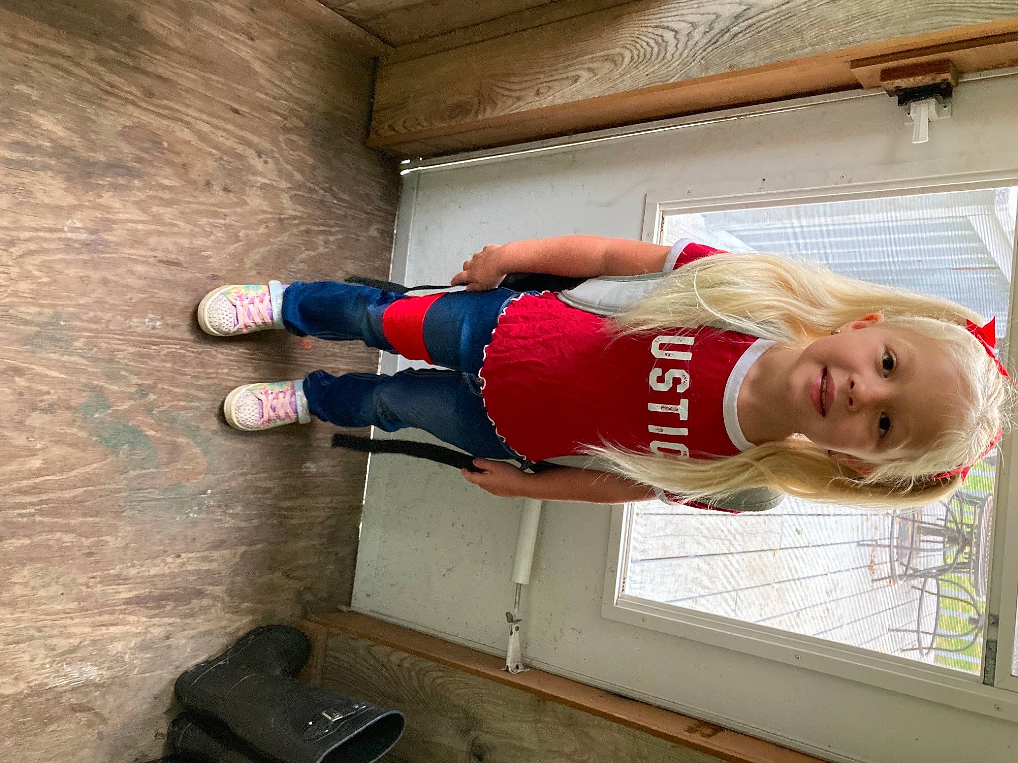 Bentleigh is registered to the contest to win money with this photo: bag, balance, elbow, electric_blue, fun, human_leg, joy, knee, luggage_and_bags, person, physical_fitness, recreation, shorts, smile, sports_uniform, sportswear, t_shirt, thigh, trunk, walking_shoe