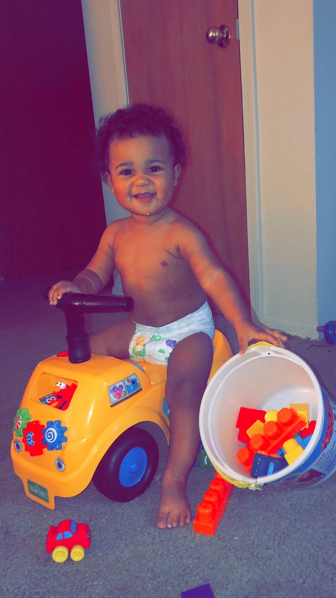 Aydrian joined the competition — help win amazing prizes! baby_products, baby_toys, child, joy, leg, person, play, playset, potty_training, product, riding_toy, sitting, toddler, toy, vehicle