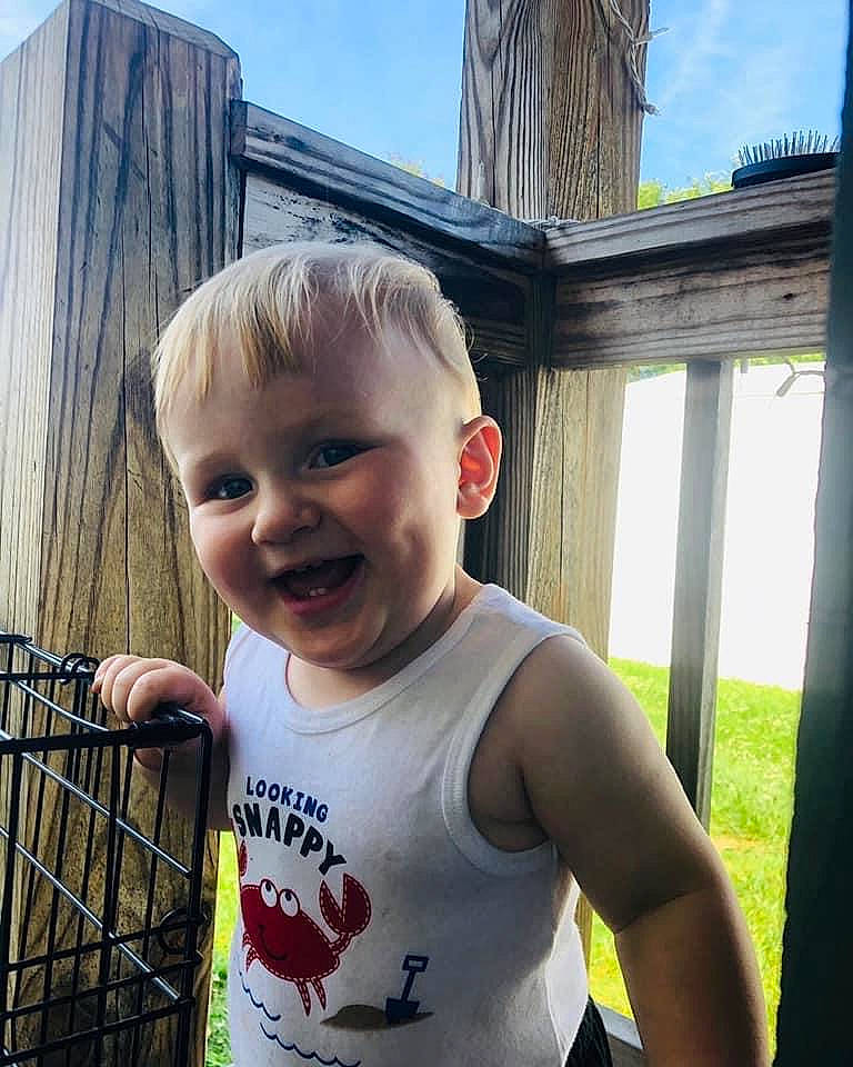 Braven is registered to the contest to win money with this photo: arm, baby, child, cool, ear, eye, face, facial_expression, grass, happy, head, joy, people, person, plant, skin, smile, summer, t_shirt, toddler