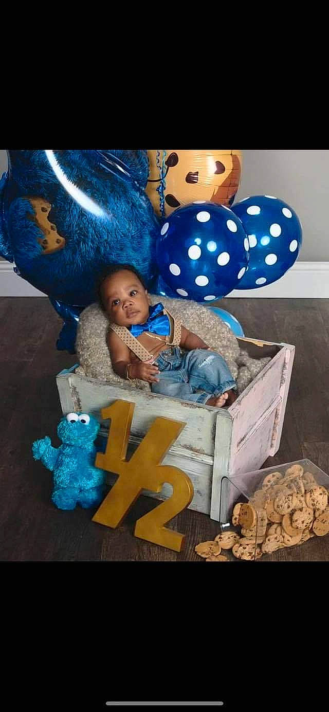 Markis joined the competition — help win amazing prizes! baby_toddler_clothing, blue, box, child, electric_blue, event, fun, happy, pattern, person, plastic, product, room, sitting, sleeve, toddler, toy