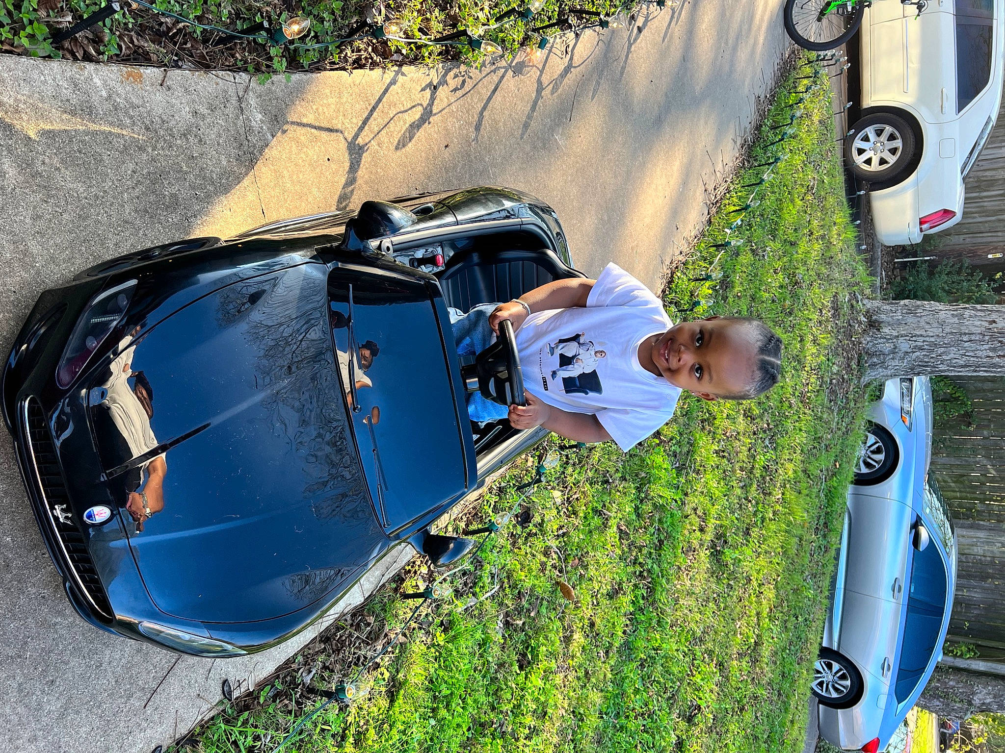 Kasen is registered to the contest to win money with this photo: asphalt, automotive_design, automotive_exterior, automotive_lighting, automotive_tire, automotive_wheel_system, bumper, car, fender, helmet, hood, joy, motor_vehicle, person, plant, sports_gear, tire, tree, vehicle, vehicle_door