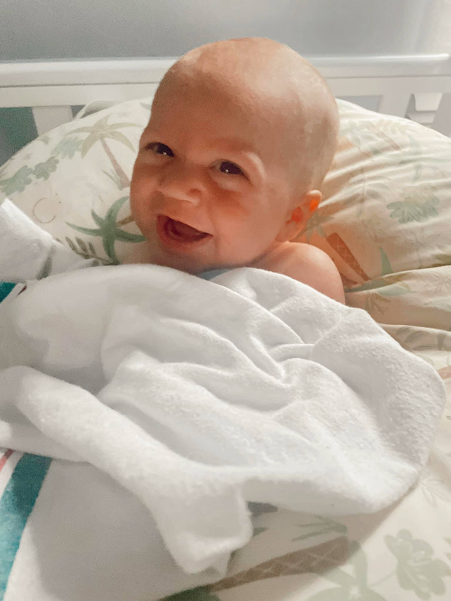 Bentlee is registered to the contest to win money with this photo: baby, baby_toddler_clothing, bedding, cheek, child, comfort, eyebrow, human_body, linens, person, room, smile, textile, thumb, toddler