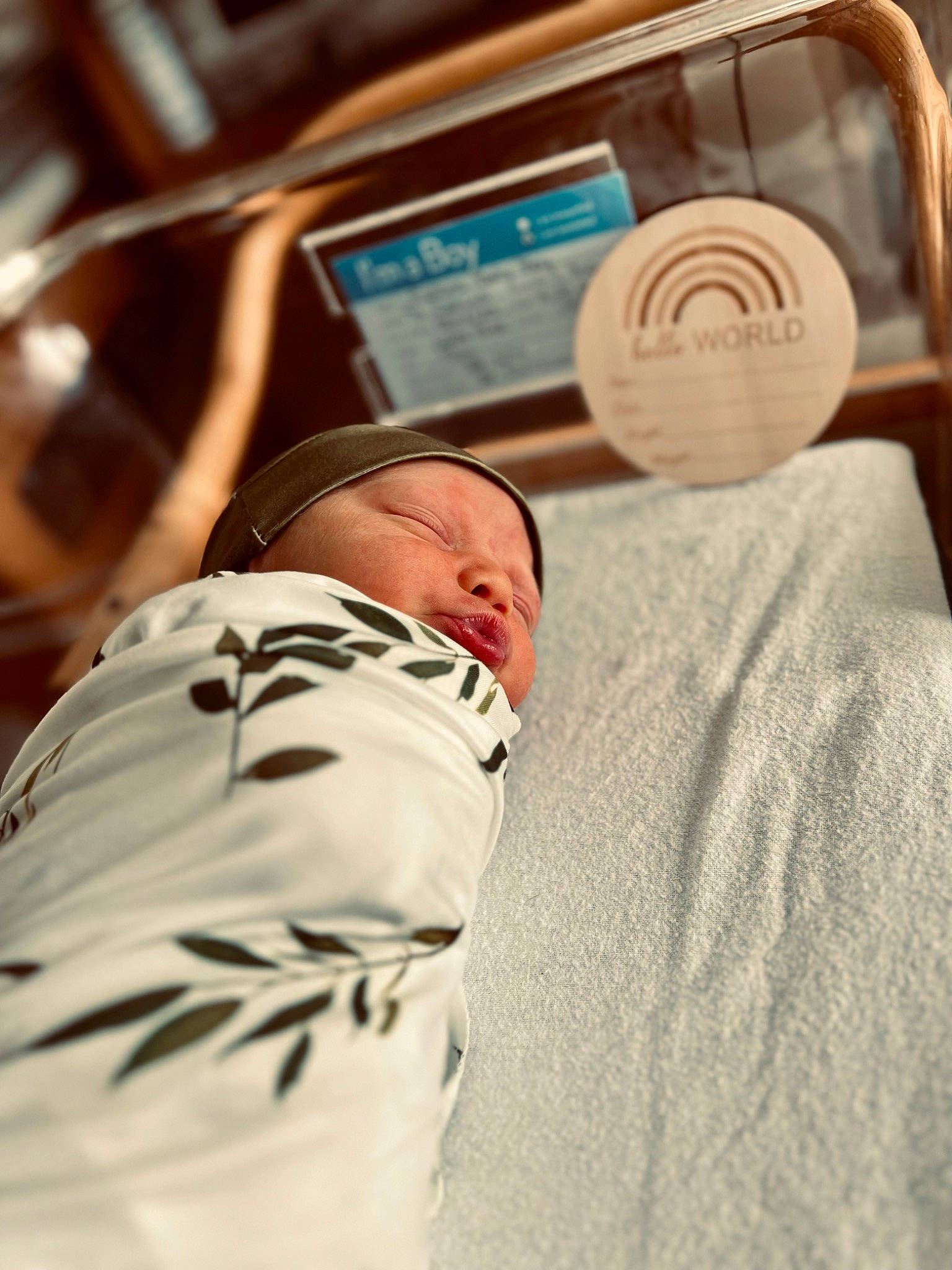 Layne is registered to the contest to win money with this photo: audio_equipment, baby, bed_sheet, bedding, child, comfort, event, eyewear, hat, hospital, linens, nap, person, room, sitting, sleep, steering_wheel, t_shirt, toddler, vehicle_door