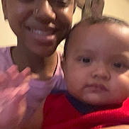 Marcus joined the competition — help win amazing prizes! arm, baby, blurry, casual, child, closeup, face, family, headband, holding, home, indoor, nose_ring, portrait, red_sweater, selfie, skin_tone, smile, teen, wall_art