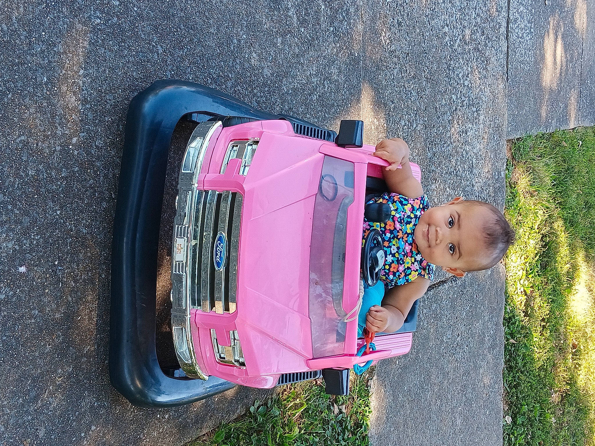 Ka'Mara joined the competition — help win amazing prizes! automotive_exterior, automotive_lighting, automotive_tail_brake_light, automotive_tire, baby_toddler_clothing, bumper, car, fender, joy, motor_vehicle, person, pink, plant, rolling, tints_and_shades, tire, toddler, tree, vehicle, vehicle_door