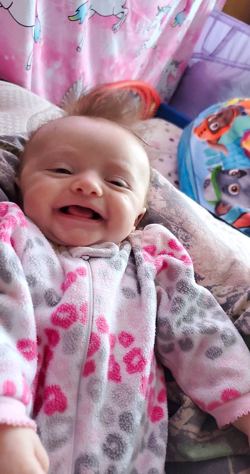 Ensleigh is registered to the contest to win money with this photo: baby, cheek, child, eye, face, facial_expression, head, lip, mouth, person, pink, skin, smile, textile, toddler