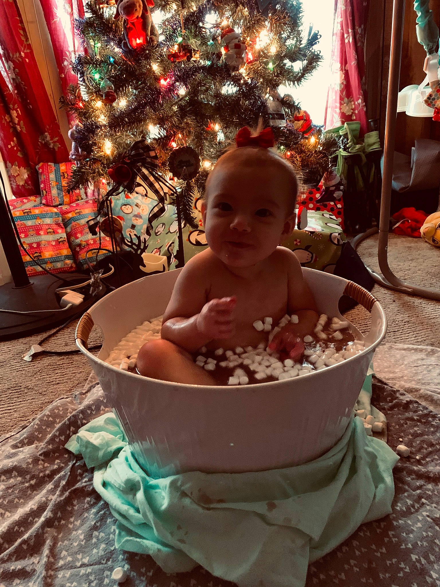 Ava Rae joined the competition — help win amazing prizes! baby, baby_products, baby_toddler_clothing, bathing, beauty, child, christmas, christmas_decoration, christmas_ornament, christmas_tree, event, fun, happy, head, holiday, holiday_ornament, ornament, person, sitting, tableware