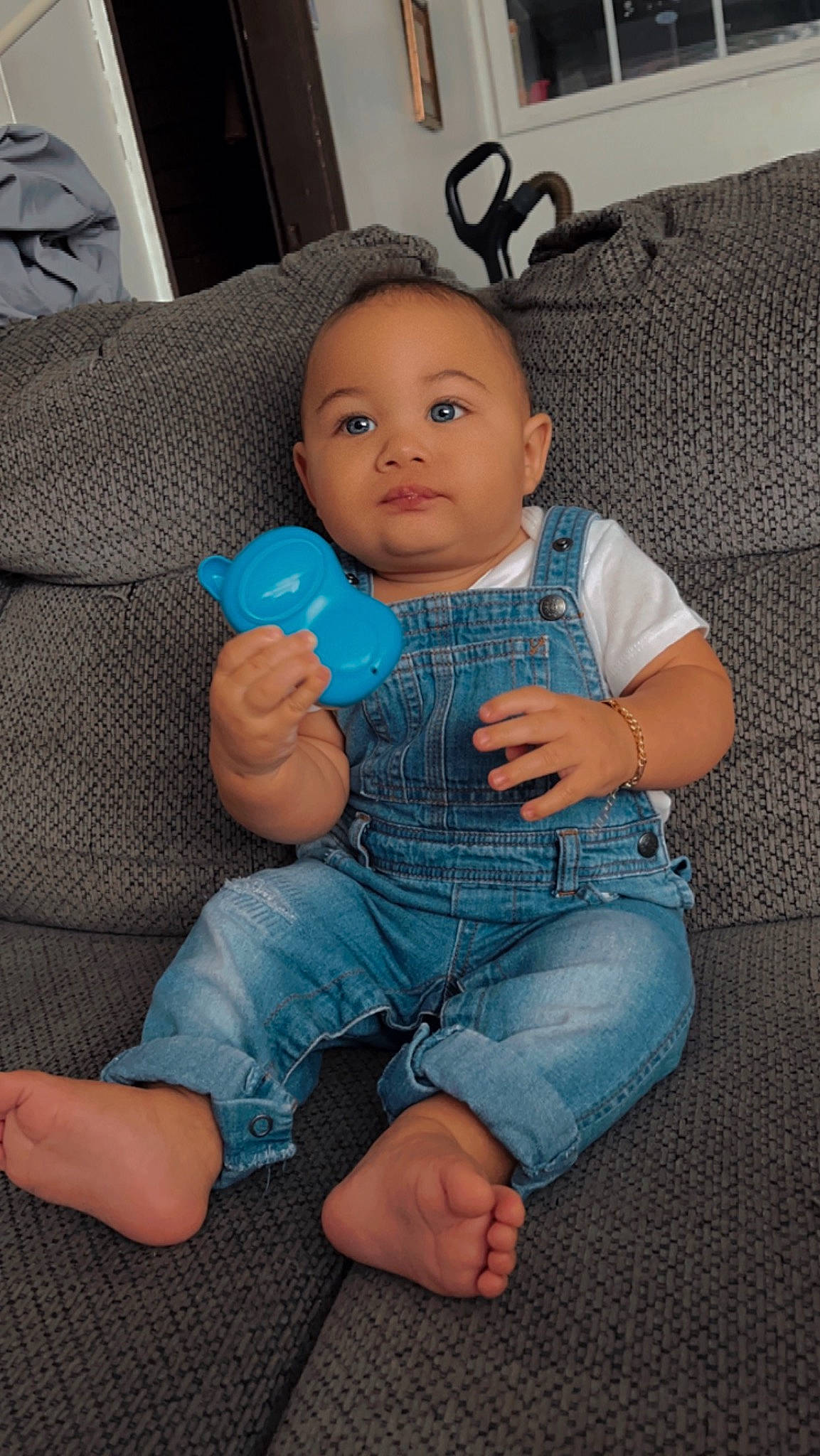 Elijah is registered to the contest to win money with this photo: azure, baby, baby_toddler_clothing, cheek, clothing, comfort, eye, finger, flooring, gesture, hairstyle, human_body, jeans, joint, mouth, nose, person, skin, sleeve, stomach