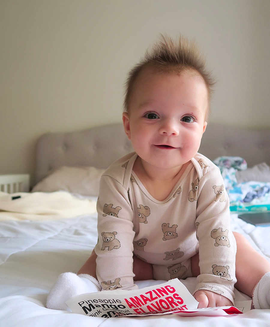 Grace joined the competition — help win amazing prizes! baby, bed, bedroom, bodypart, couch, crawling, cushion, face, finger, furniture, hand, head, homedecor, indoors, person, photography, portrait, room, sitting, text