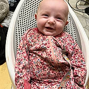 Haylen joined the competition — help win amazing prizes! baby, baby_seat, casual, child, clothing, comfort, fabric, face, floor, floral_pattern, happy, indoor, infant, onesie, pattern, person, seat, smiling, tiled_floor, zipper