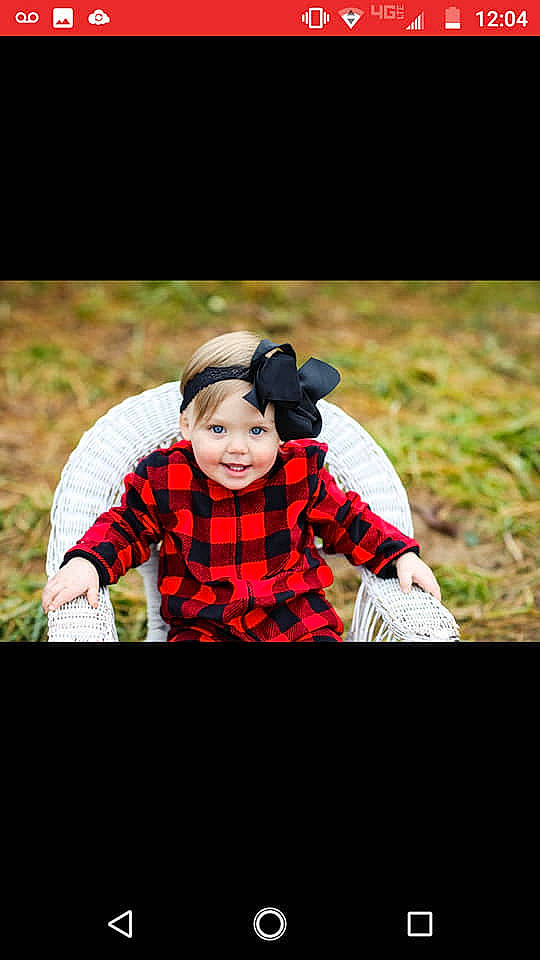 Novalee is registered to the contest to win money with this photo: advertising, fun, girl, grass, joy, person, photo_caption, photograph, photography, portrait_photography, product, red, sitting, smile