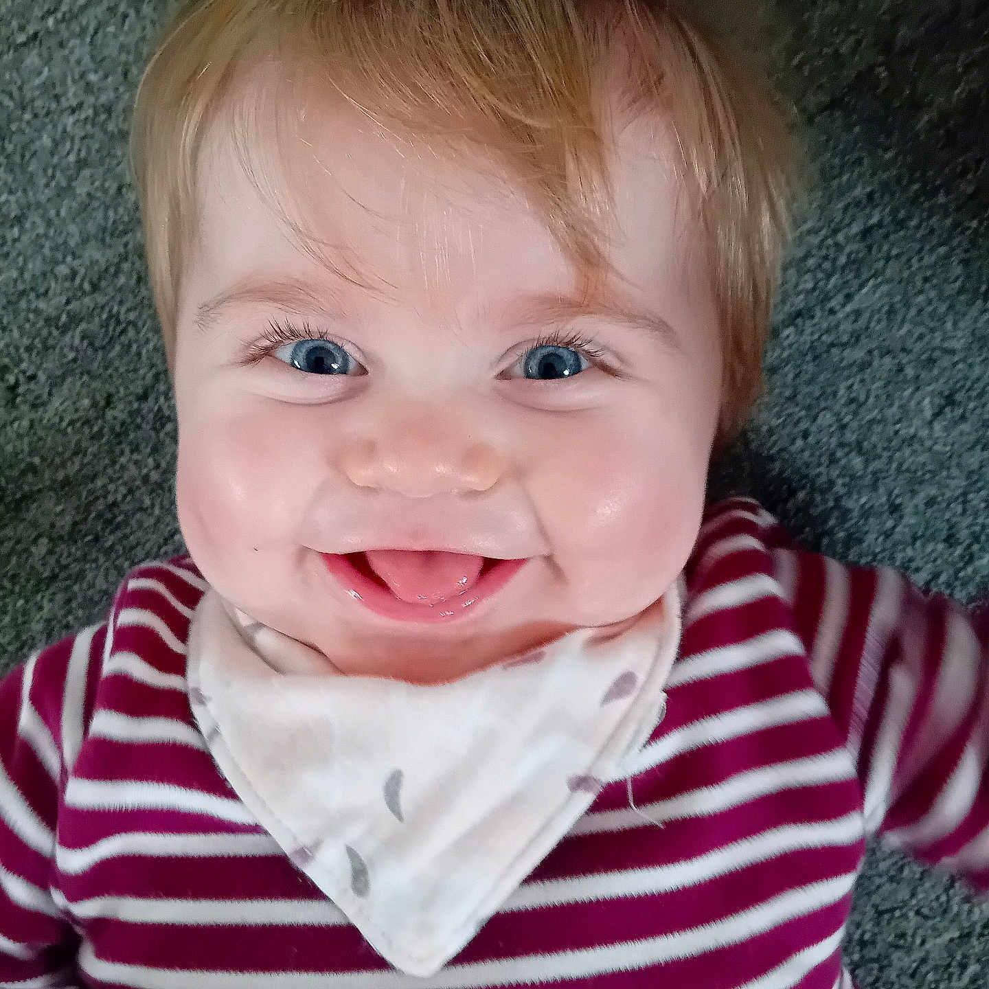 Laurel is registered to the contest to win money with this photo: applique, baby, babylaughing, bodypart, clothing, dress, face, finger, hand, happy, head, laughing, mouth, newborn, person, photography, portrait, shirt, smile, teeth