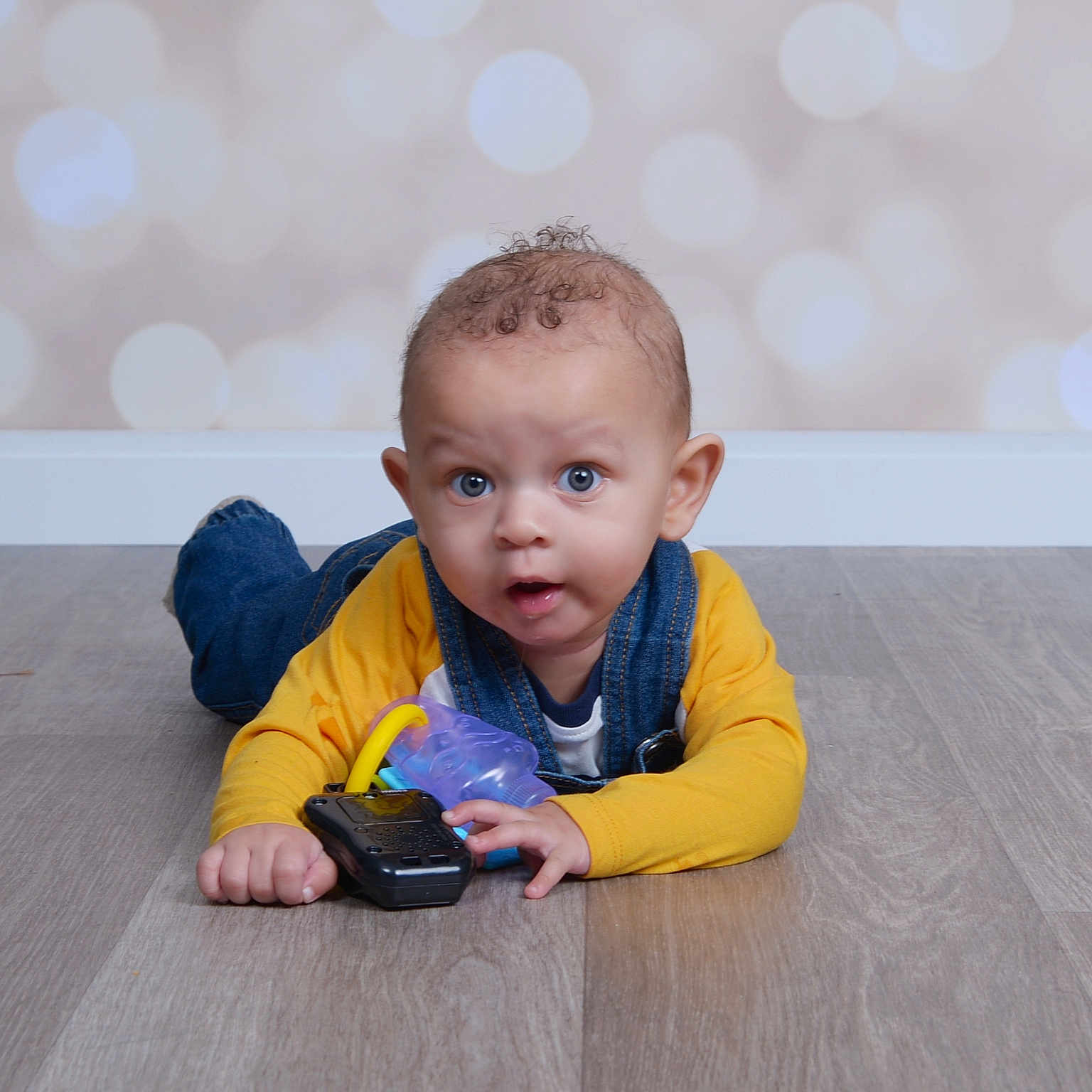 Gregg joined the competition — help win amazing prizes! baby, bodypart, clothing, crawling, face, finger, hand, happy, hardwood, head, jeans, pants, person, photography, plywood, portrait, sitting, smile, videogaming, wood