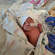 Elena joined the competition — help win amazing prizes! newborn, baby, infant, sleeping, hospital, medical, incubator, oxygen_tube, nasal_cannula, cap, blanket, swaddled, premature_baby, bed, gloves, healthcare, portrait, face, tiny_fist, indoors