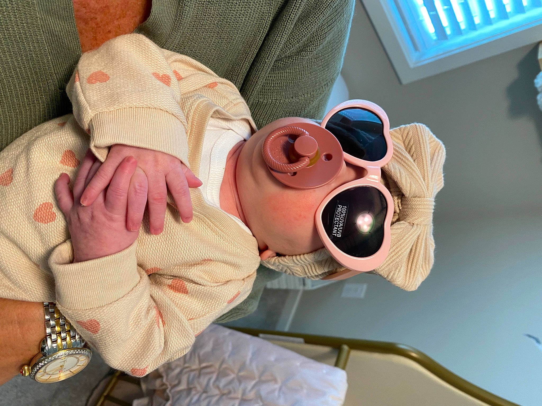 Saylor is registered to the contest to win money with this photo: camera, comfort, elbow, eyewear, finger, fun, gesture, goggles, hand, happy, hat, mouth, nail, neck, person, pink, shoulder, sunglasses, textile, vision_care