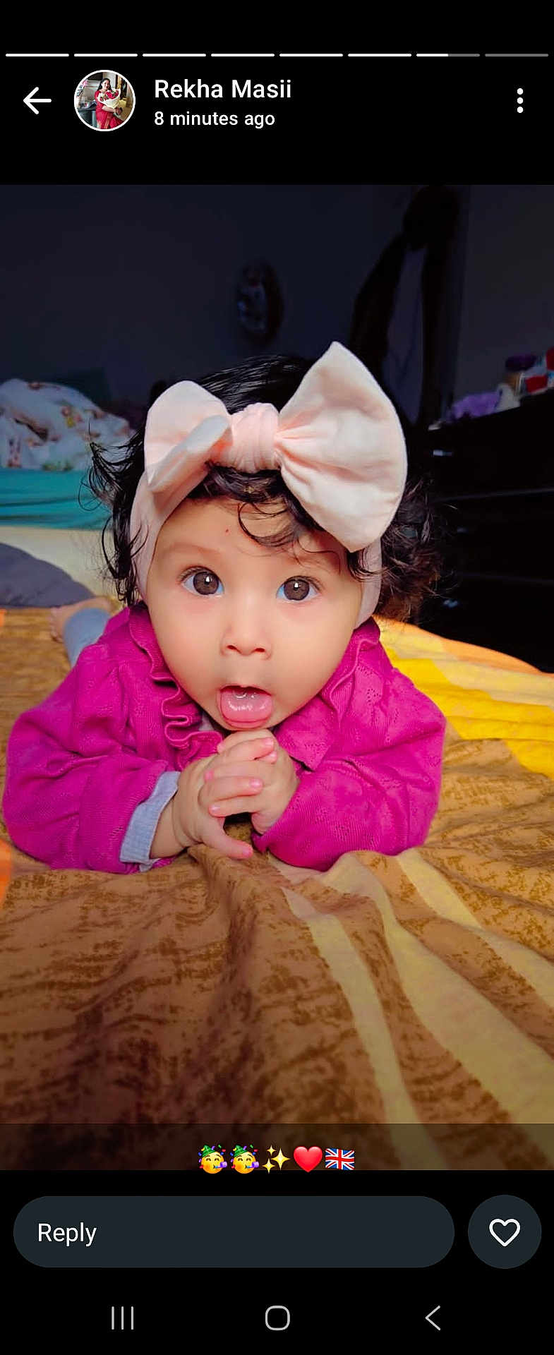 Anrika joined the competition — help win amazing prizes! baby, child, pink_bow, headband, wide_eyes, curly_hair, blanket, indoor, cute, portrait, infant, expression, hands, clothing, lying_down, face, adorable, young_child, bedroom, curiosity