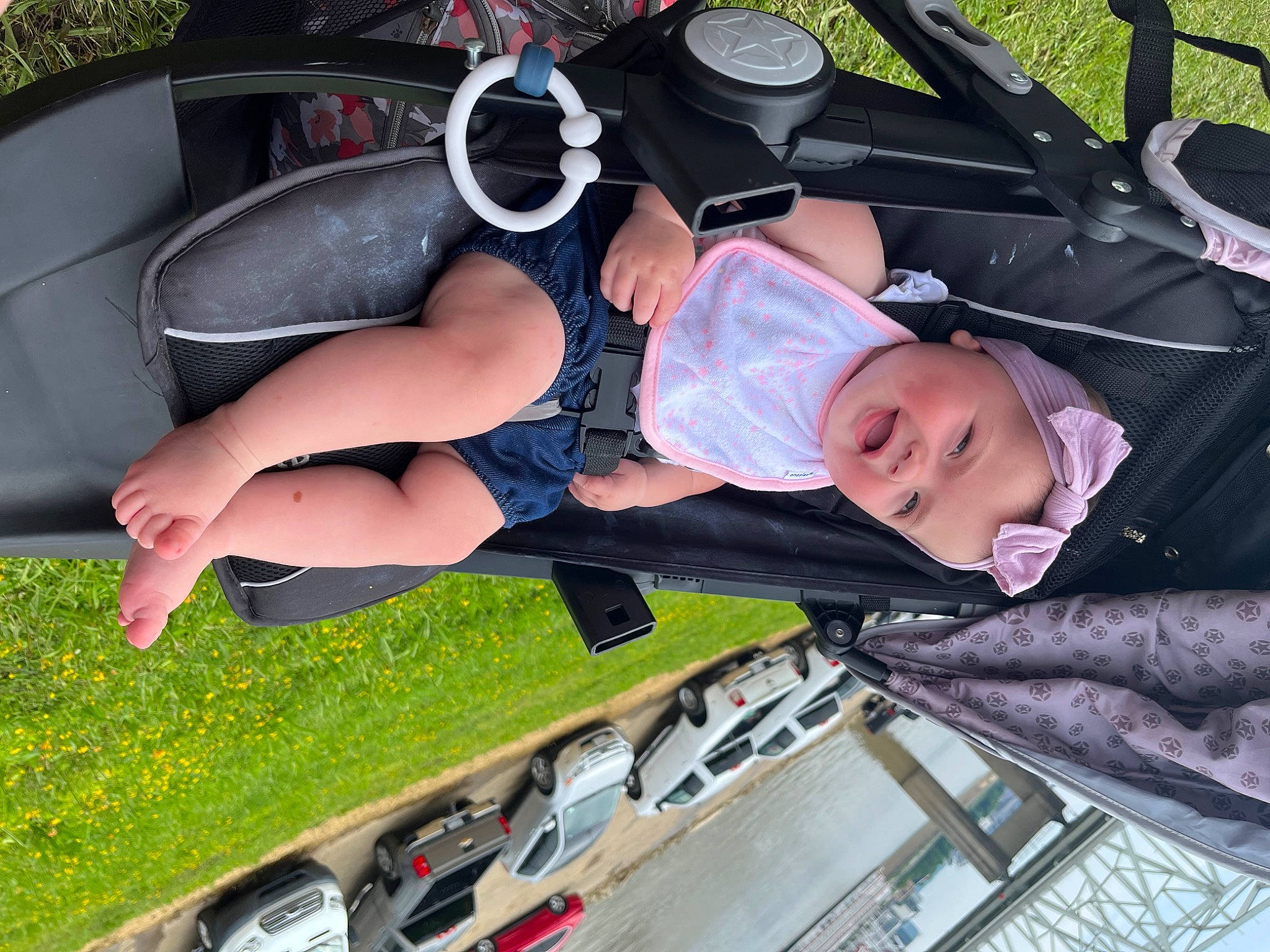 Jaylee is registered to the contest to win money with this photo: audio_equipment, auto_part, automotive_design, automotive_exterior, automotive_tire, automotive_wheel_system, baby, bumper, car, eyewear, family_car, fun, grass, headwear, human_leg, motor_vehicle, person, shoe, thigh, toddler