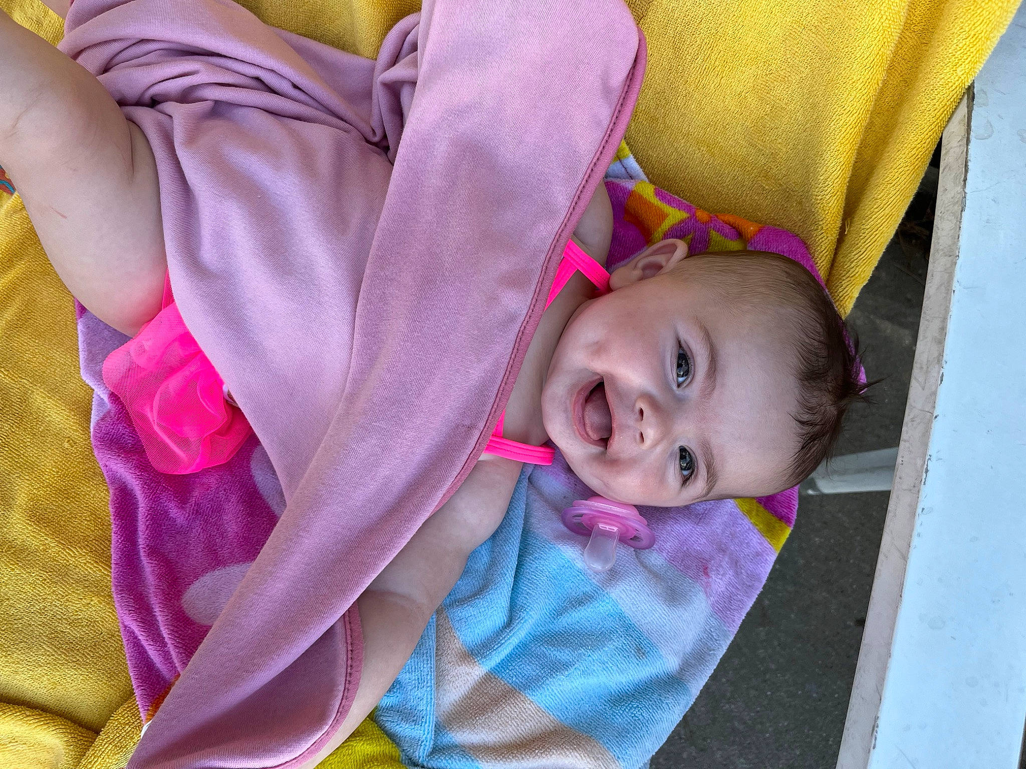 Jaylee joined the competition — help win amazing prizes! baby_products, child, comfort, facial_expression, fun, grass, happy, leaf, leisure, linens, magenta, person, pink, plant, purple, skin, smile, textile, toddler, tree