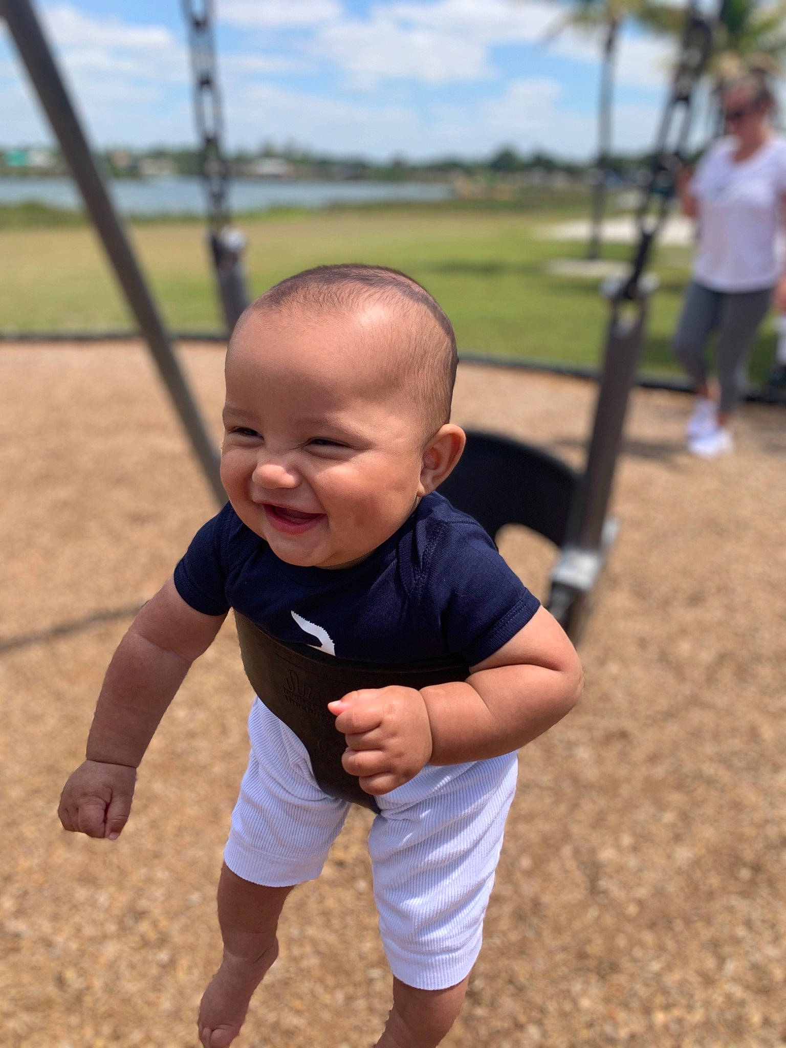 Kyree joined the competition — help win amazing prizes! baby, baby_toddler_clothing, cloud, fun, grass, happy, joy, leisure, outdoor_play_equipment, people_in_nature, person, plant, playground, recreation, skin, sky, sleeve, smile, swing, t_shirt