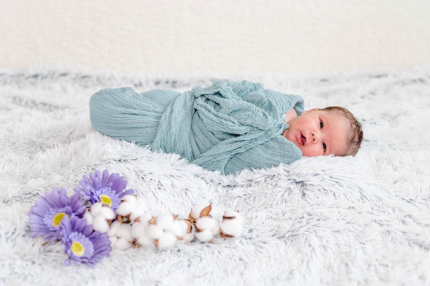 Lakelyn is registered to the contest to win money with this photo: baby, baby_sleeping, bedding, comfort, fashion_accessory, flower, flower_arranging, freezing, fur, grass, happy, knit_cap, linens, person, petal, plant, textile, toddler, winter, wood