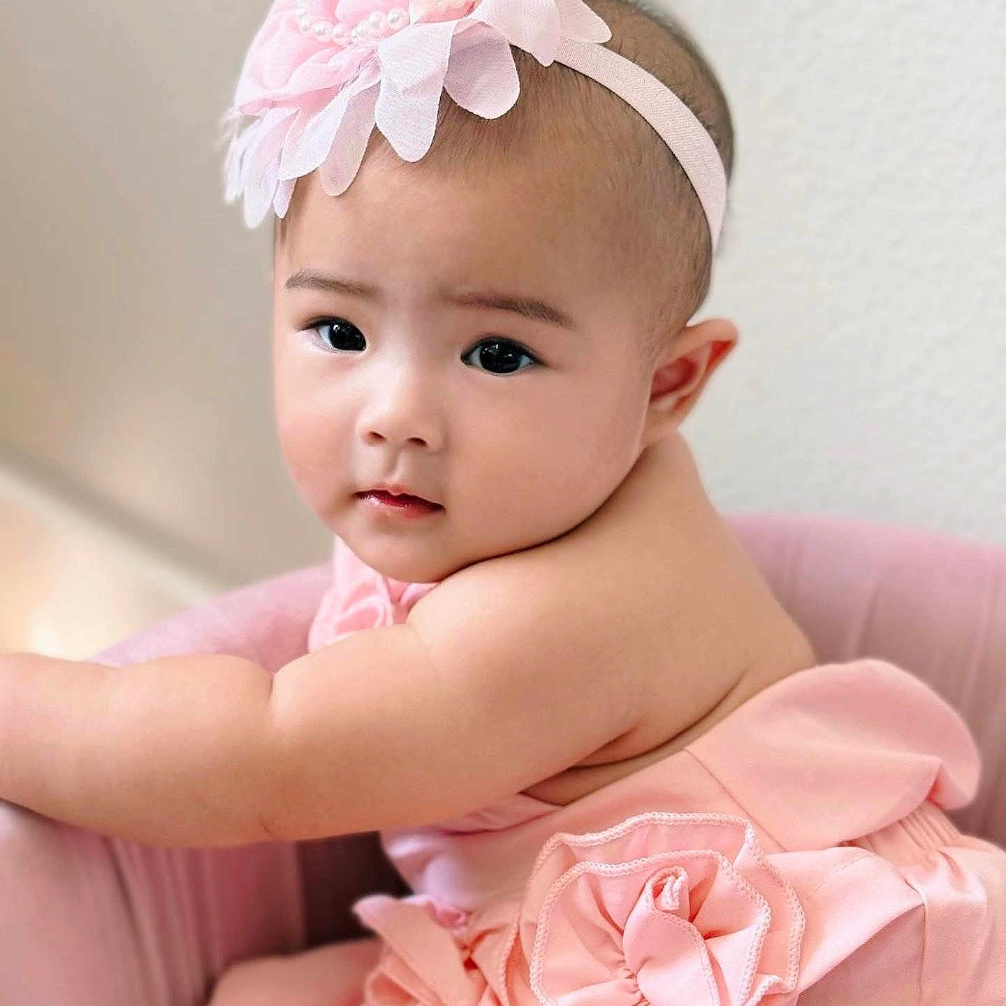 Callie joined the competition — help win amazing prizes! adorable, arm, baby, chair, child, closeup, cute, dress, expression, face, flower, headband, indoors, infant, person, pink, portrait, sitting, skin, soft_light