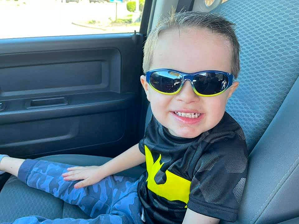 Baron is registered to the contest to win money with this photo: arm, automotive_design, automotive_exterior, azure, car_seat, car_seat_cover, eyewear, glasses, goggles, hand, joy, mammal, motor_vehicle, person, product, seat_belt, smile, steering_part, sunglasses, vehicle_door