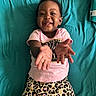 Ravyn joined the competition — help win amazing prizes! arms_outstretched, baby, bed, child, clothing, cute, expression, happy, indoor, joyful, leopard_print, person, pink_shirt, playful, portrait, shorts, smiling, teal_bedspread, toddler, young_child