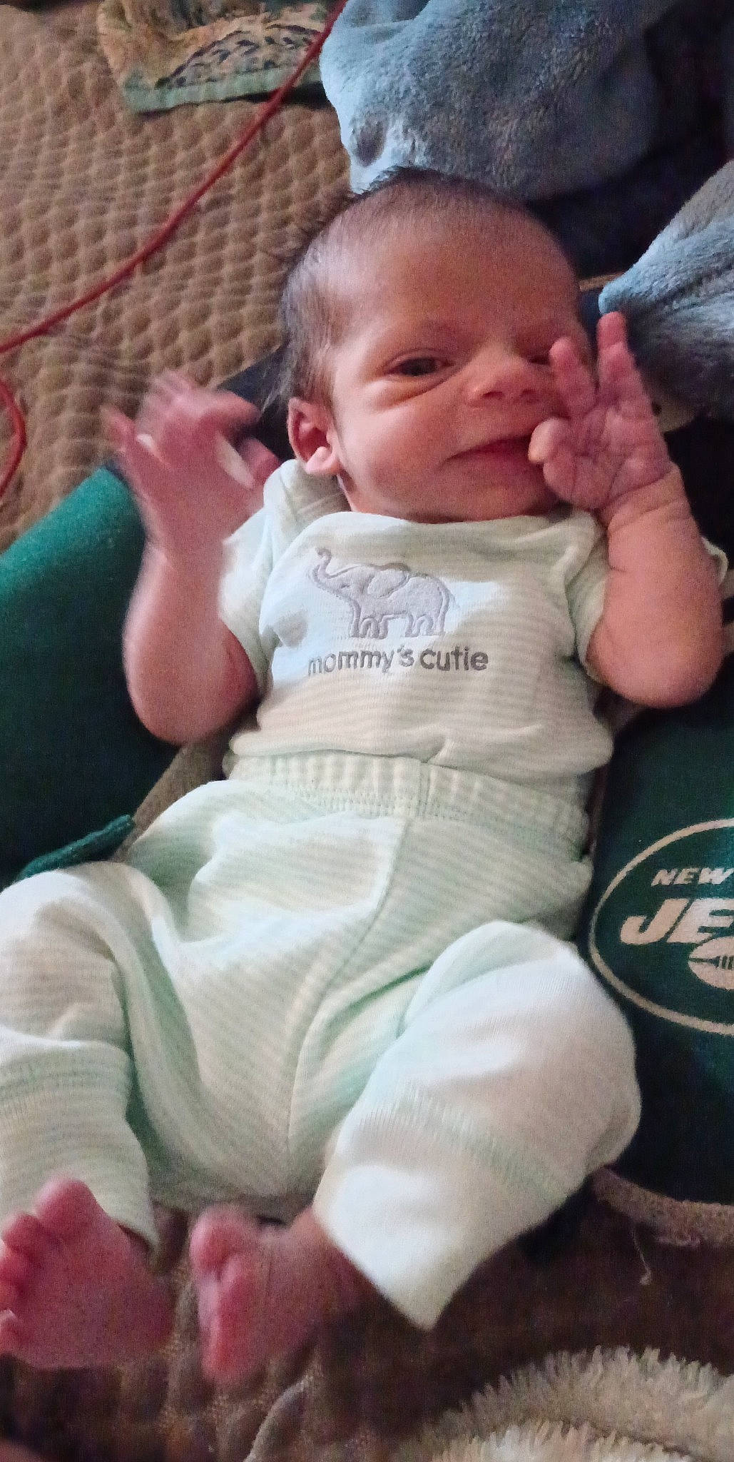 Benjamin is registered to the contest to win money with this photo: baby, baby_products, baby_toddler_clothing, cheek, child, chin, comfort, eye, grass, happy, head, lip, mouth, nail, nose, person, skin, sleeve, smile, thumb