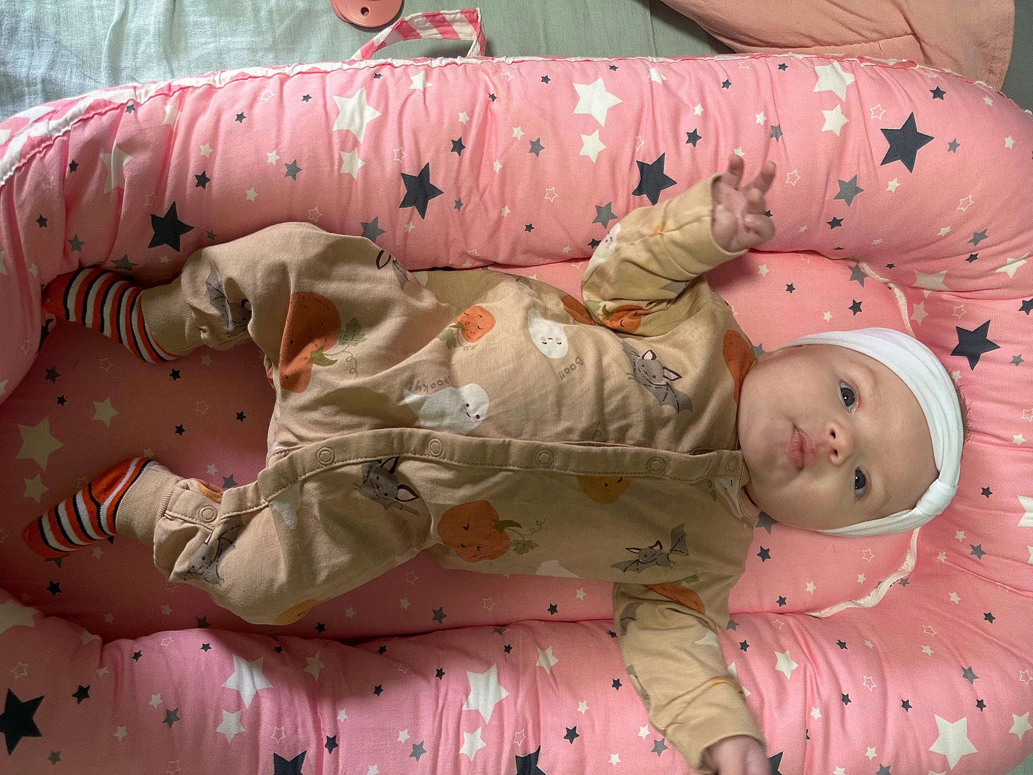 Isabella is registered to the contest to win money with this photo: baby, baby_products, baby_sleeping, baby_toddler_clothing, bedding, bedtime, cheek, child, comfort, headwear, linens, nap, pattern, peach, person, pink, room, sleep, sleeve, textile